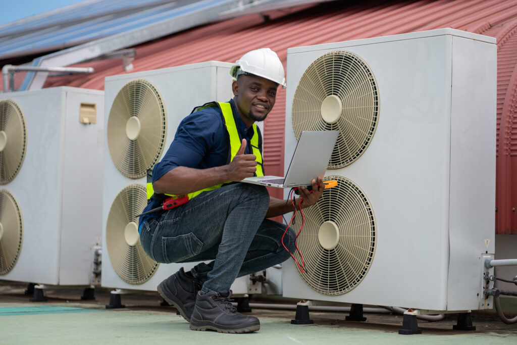 Engineers inspecting the air conditioning system in a large building or industrial facility.
